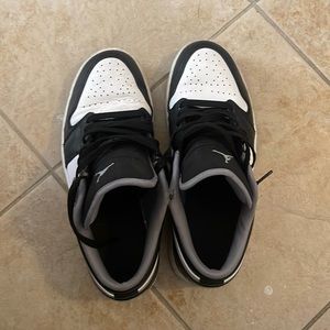 Jordan 1 low black, white, and grey